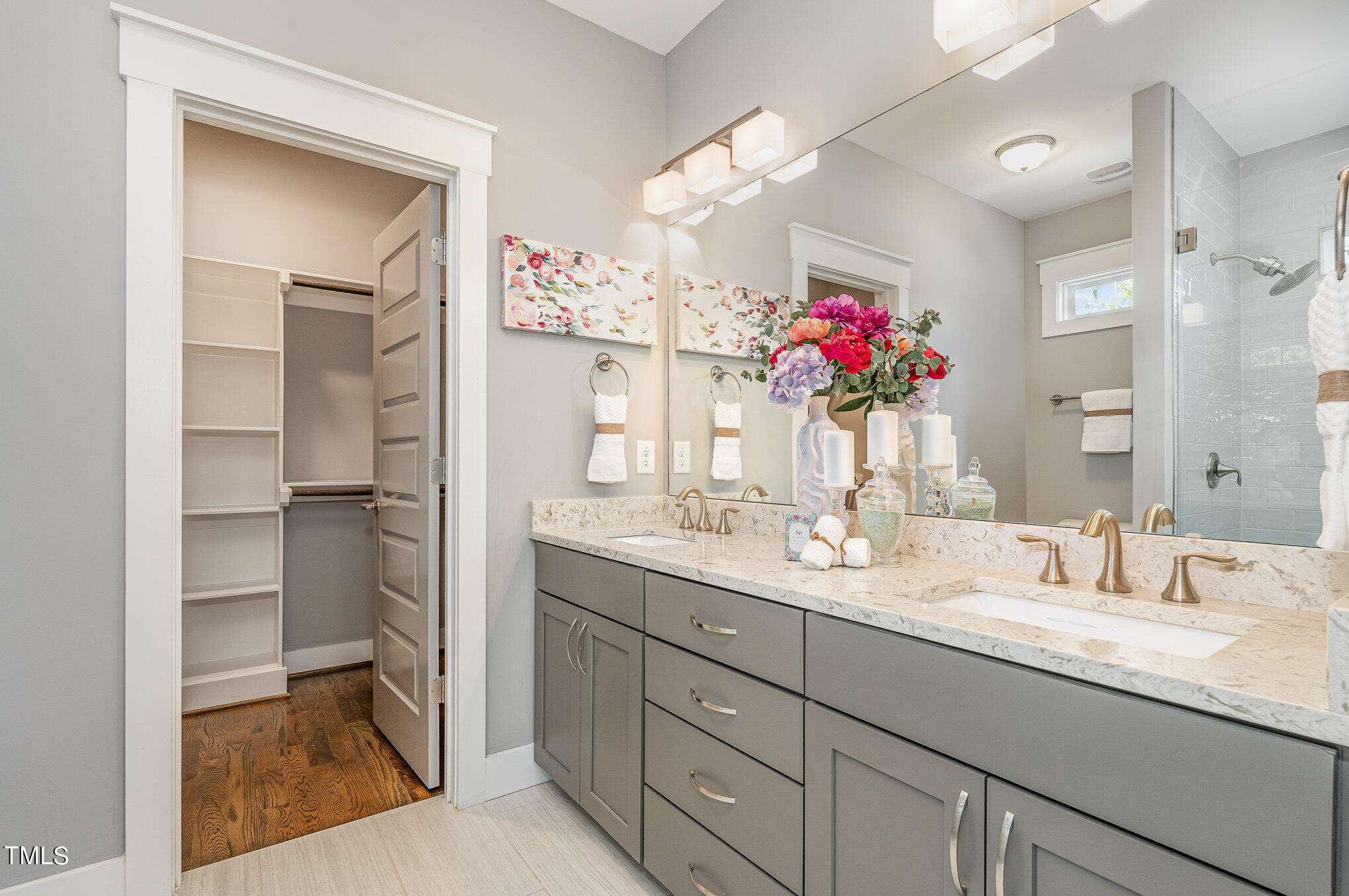 719 East Lenoir Street Raleigh, NC 27601 - Photo 8 of 16 a bathroom with a granite countertop sink mirror and a shower