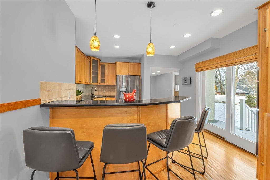 231 Lagrange Street Boston, MA 02132 - Photo 11 of 42 a view of a dining room with furniture and wooden floor