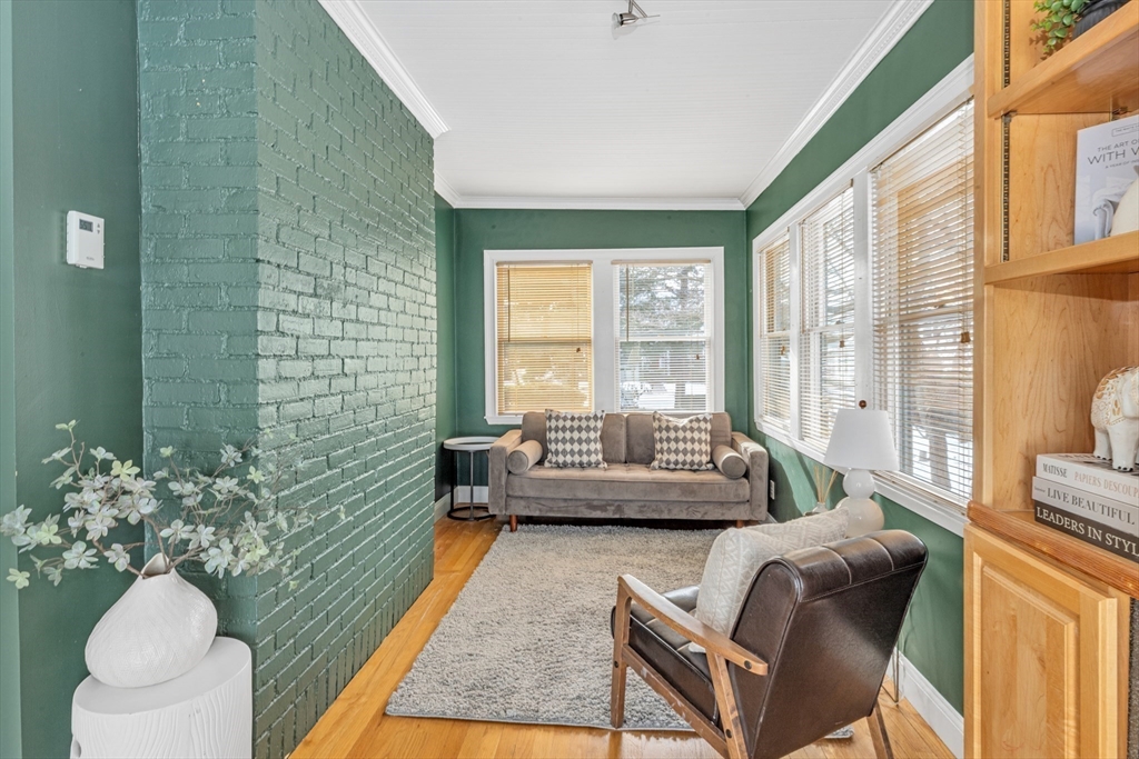 231 Lagrange Street Boston, MA 02132 - Photo 14 of 42 a living room with furniture and a large window