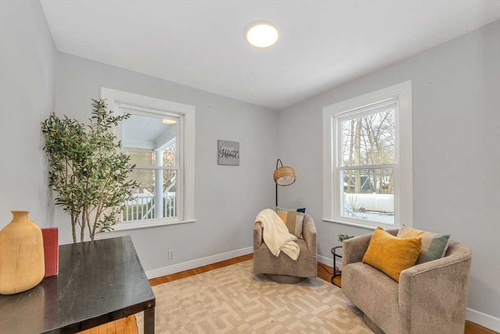 231 Lagrange Street Boston, MA 02132 - Photo 19 of 42 a living room with furniture and a window