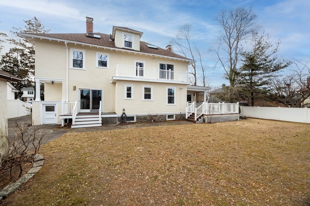231 Lagrange Street Boston, MA 02132 - Photo 39 of 42 a white house that has a tree in front of it