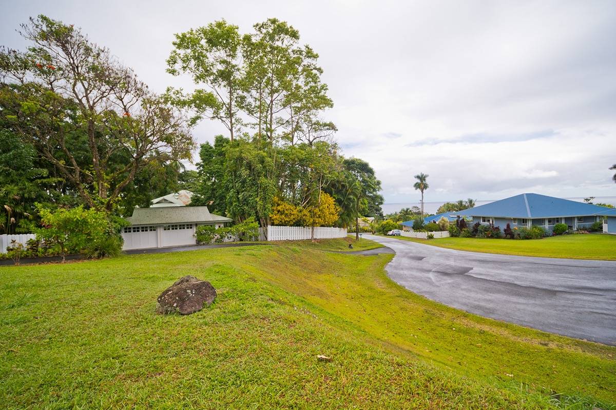 21 A Hanamalo Loop Hakalau, HI 96710 - Photo 9 of 28 a view of a swimming pool with an outdoor space and seating area