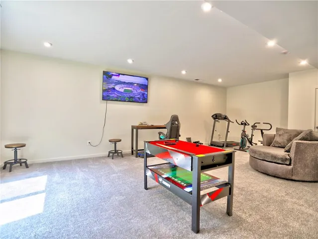 a living room with furniture gym equipment