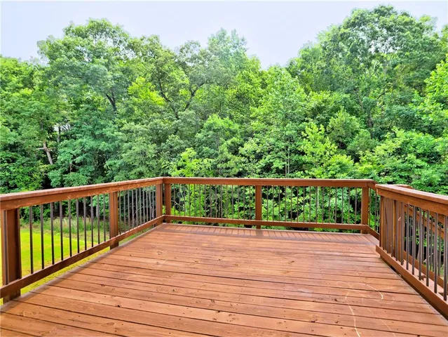 a view of balcony with wooden floor