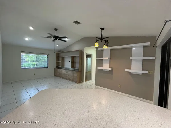 a view of kitchen and windows