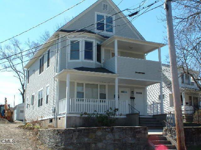 275 Jennings Road Fairfield, CT 06825 - Photo 1 of 1 a front view of a house with a yard