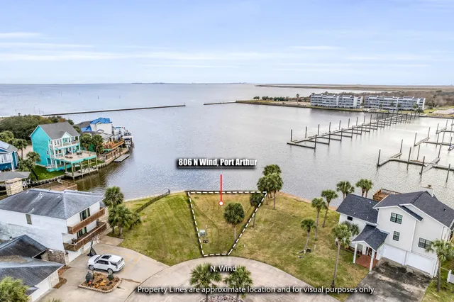 a living room with furniture and floor to ceiling window