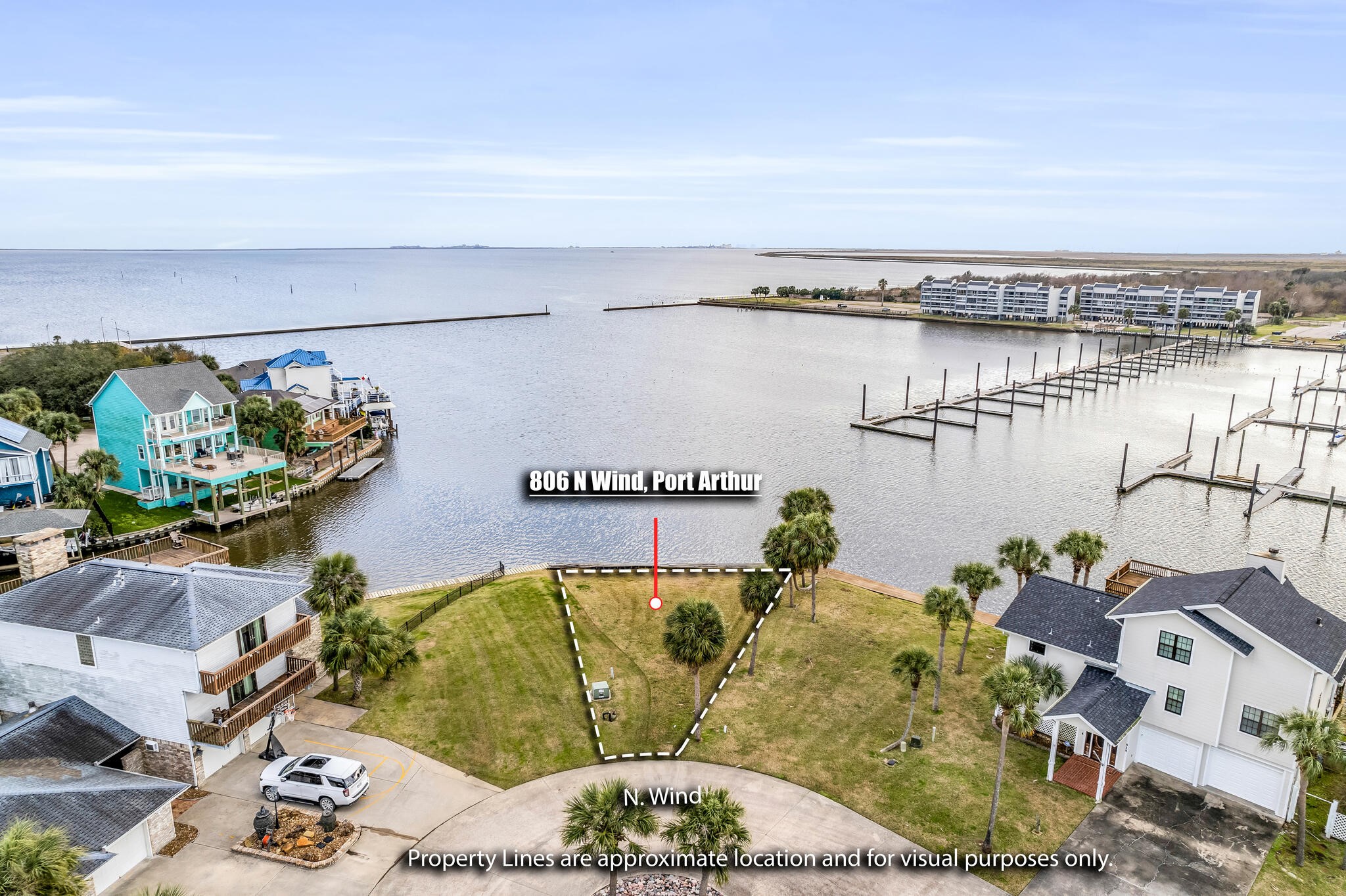 a living room with furniture and floor to ceiling window
