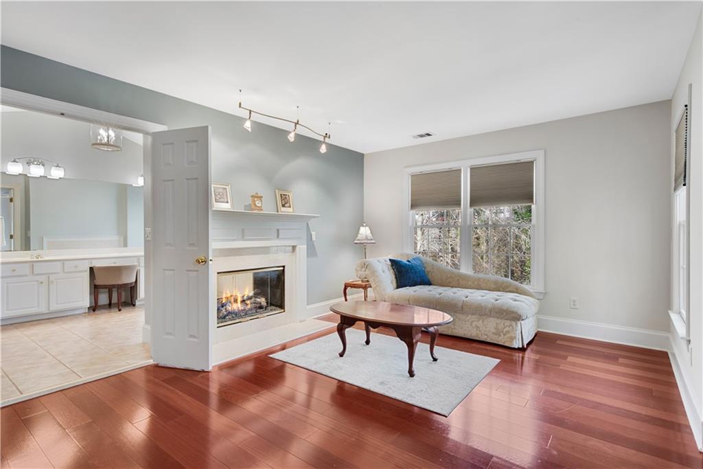 992 Wescott Lane Northeast Atlanta, GA 30342 - Photo 18 of 80 a living room with furniture and a fireplace