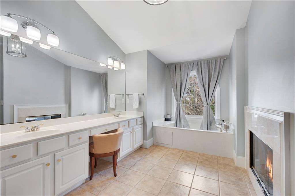 992 Wescott Lane Northeast Atlanta, GA 30342 - Photo 24 of 80 a spacious bathroom with a granite countertop sink mirror and
