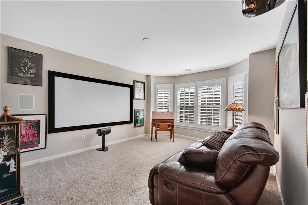 992 Wescott Lane Northeast Atlanta, GA 30342 - Photo 26 of 80 a living room with furniture and a flat screen tv