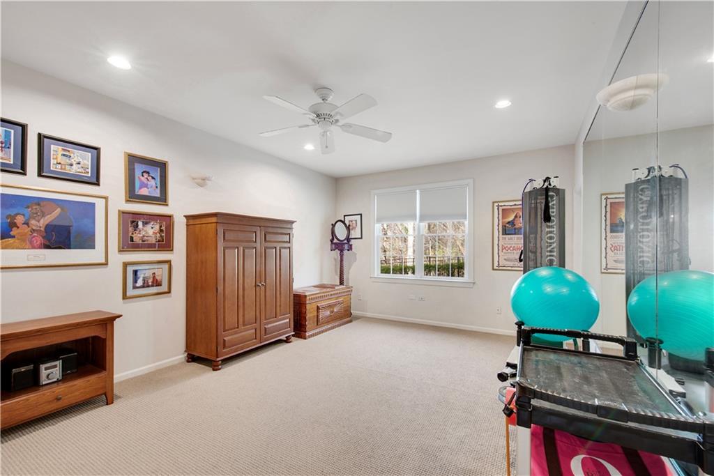 992 Wescott Lane Northeast Atlanta, GA 30342 - Photo 36 of 80 a living room with furniture a window and a ceiling fan