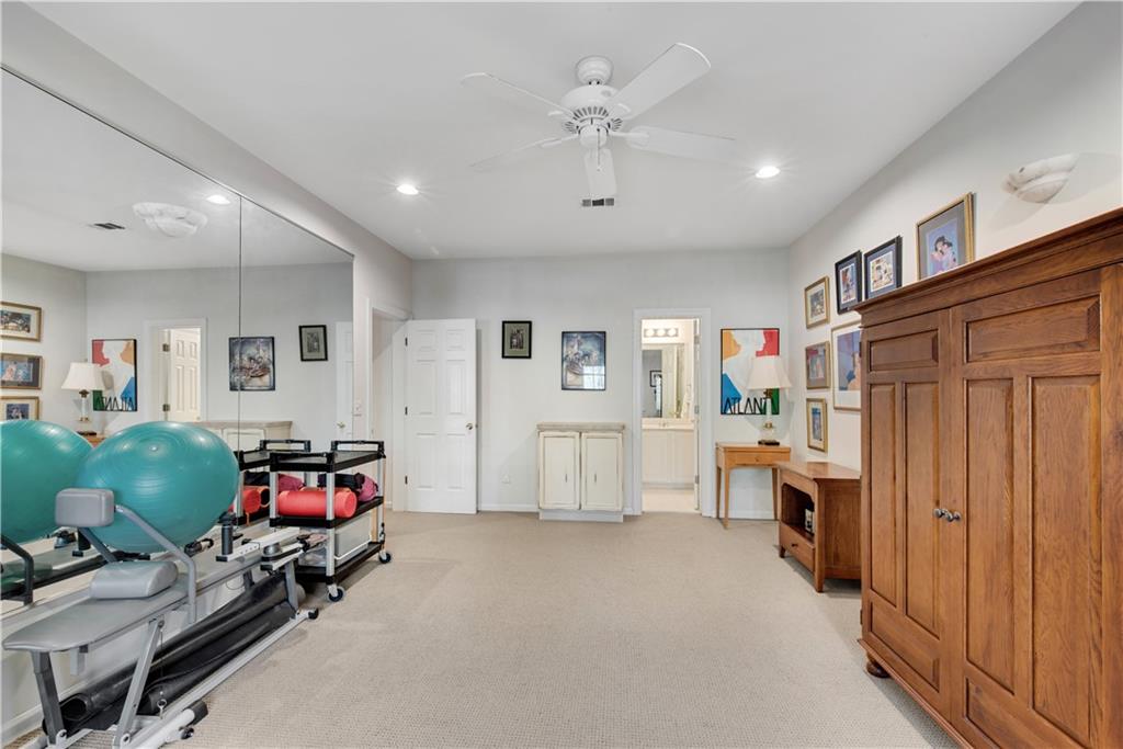 992 Wescott Lane Northeast Atlanta, GA 30342 - Photo 37 of 80 a living room with furniture and a baby crib with couch
