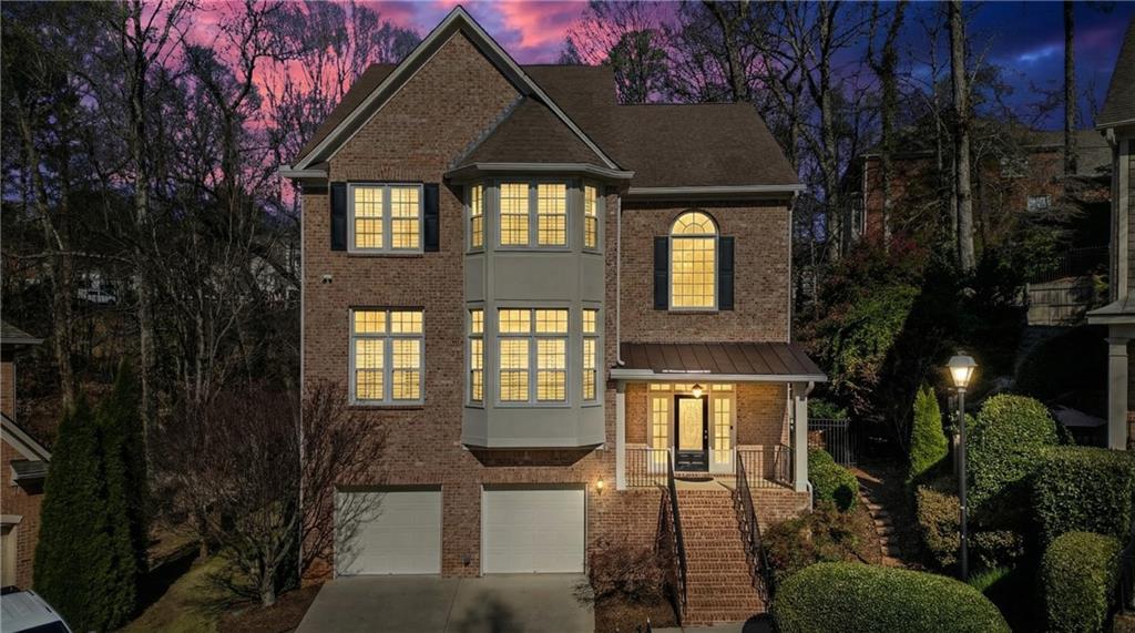 992 Wescott Lane Northeast Atlanta, GA 30342 - Photo 48 of 80 a front view of a house with a yard