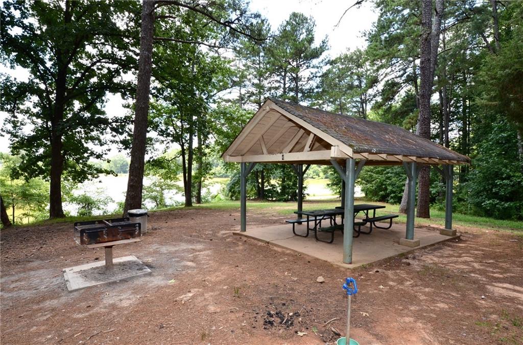 992 Wescott Lane Northeast Atlanta, GA 30342 - Photo 80 of 80 an outdoor space with furniture and umbrella