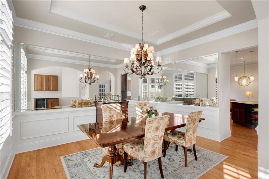 992 Wescott Lane Northeast Atlanta, GA 30342 - Photo 10 of 80 a view of a dining room with furniture and wooden floor