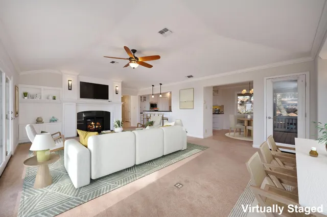 a kitchen with stainless steel appliances granite countertop a sink a refrigerator a stove and a wooden floors