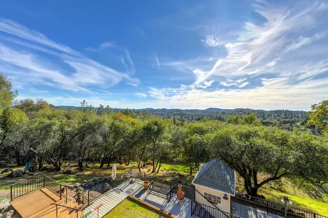 a view of a room with wooden floor windows and cabinet