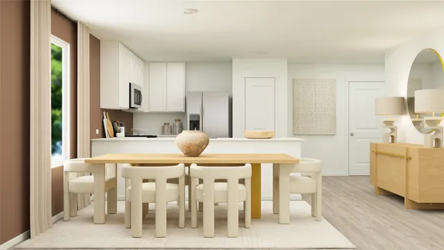 a kitchen with a table chairs sink and cabinets