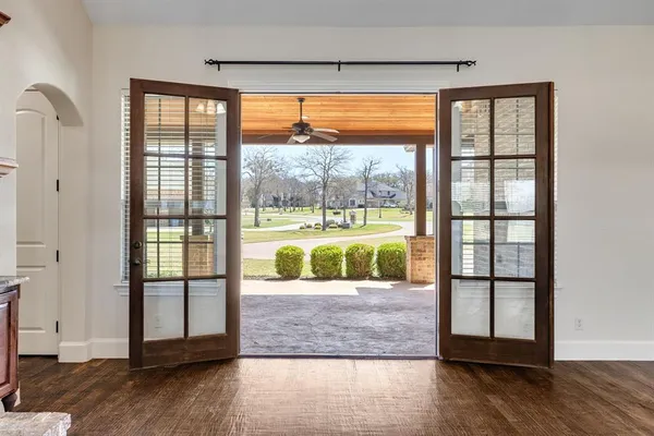 an entryway with wooden floor and door