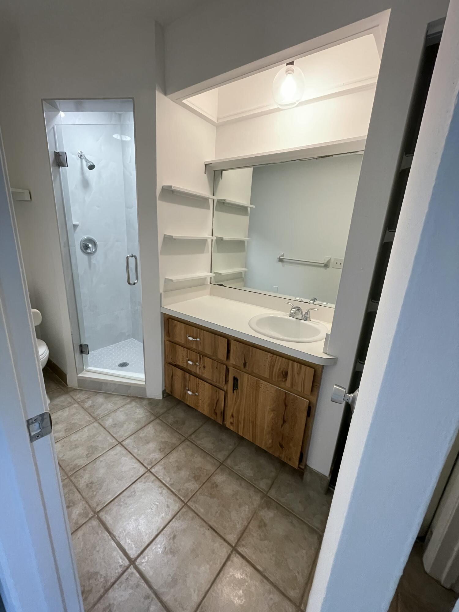 12058 Ellison Wilson Road North Palm Beach, FL 33408 - Photo 4 of 13 a bathroom with a sink a toilet and shower