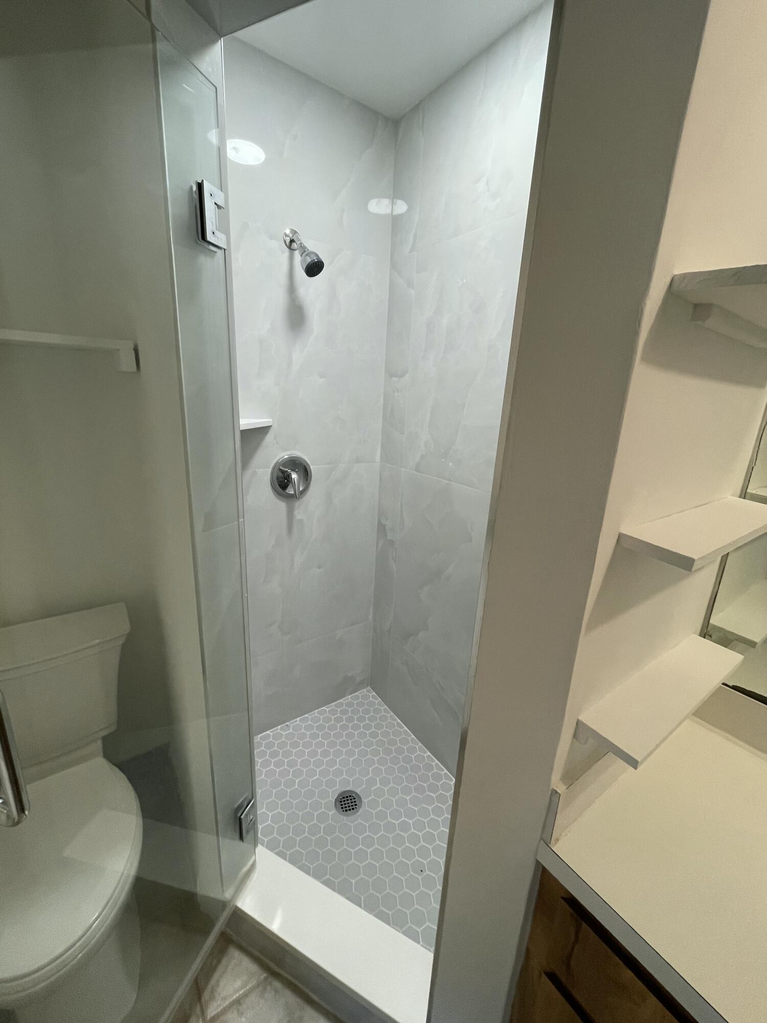 12058 Ellison Wilson Road North Palm Beach, FL 33408 - Photo 5 of 13 a bathroom with a shower and toilet