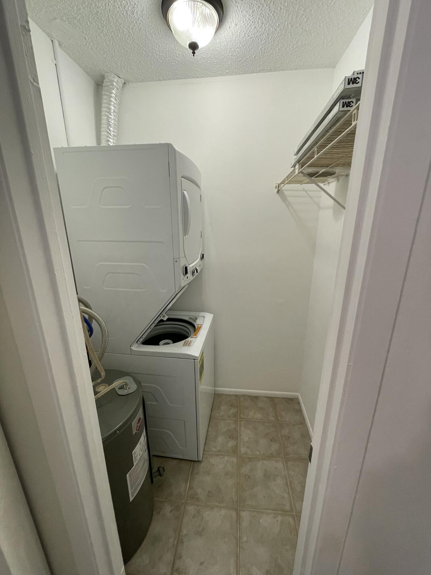 12058 Ellison Wilson Road North Palm Beach, FL 33408 - Photo 6 of 13 a room with storage and utility