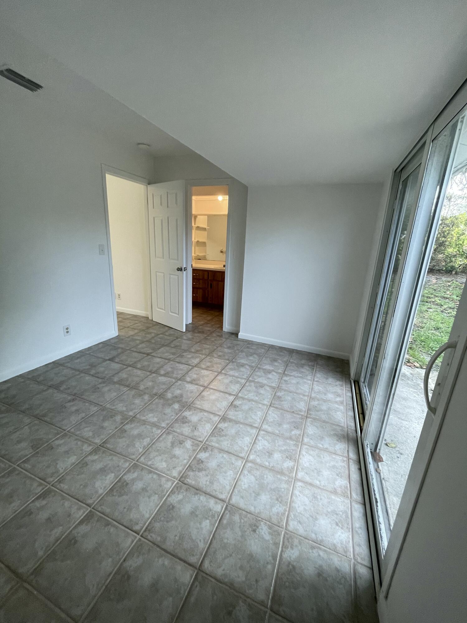 12058 Ellison Wilson Road North Palm Beach, FL 33408 - Photo 8 of 13 an empty room with windows