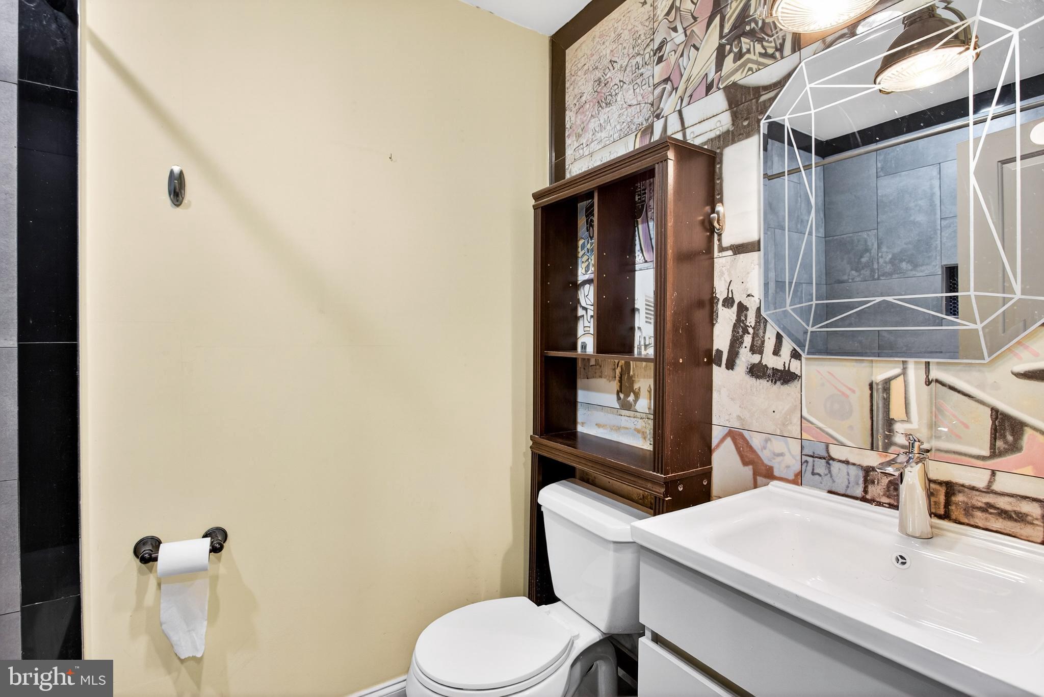 2579 Memphis Street, Unit 2 Philadelphia, PA 19125 - Photo 13 of 19 a bathroom with a sink toilet and shower
