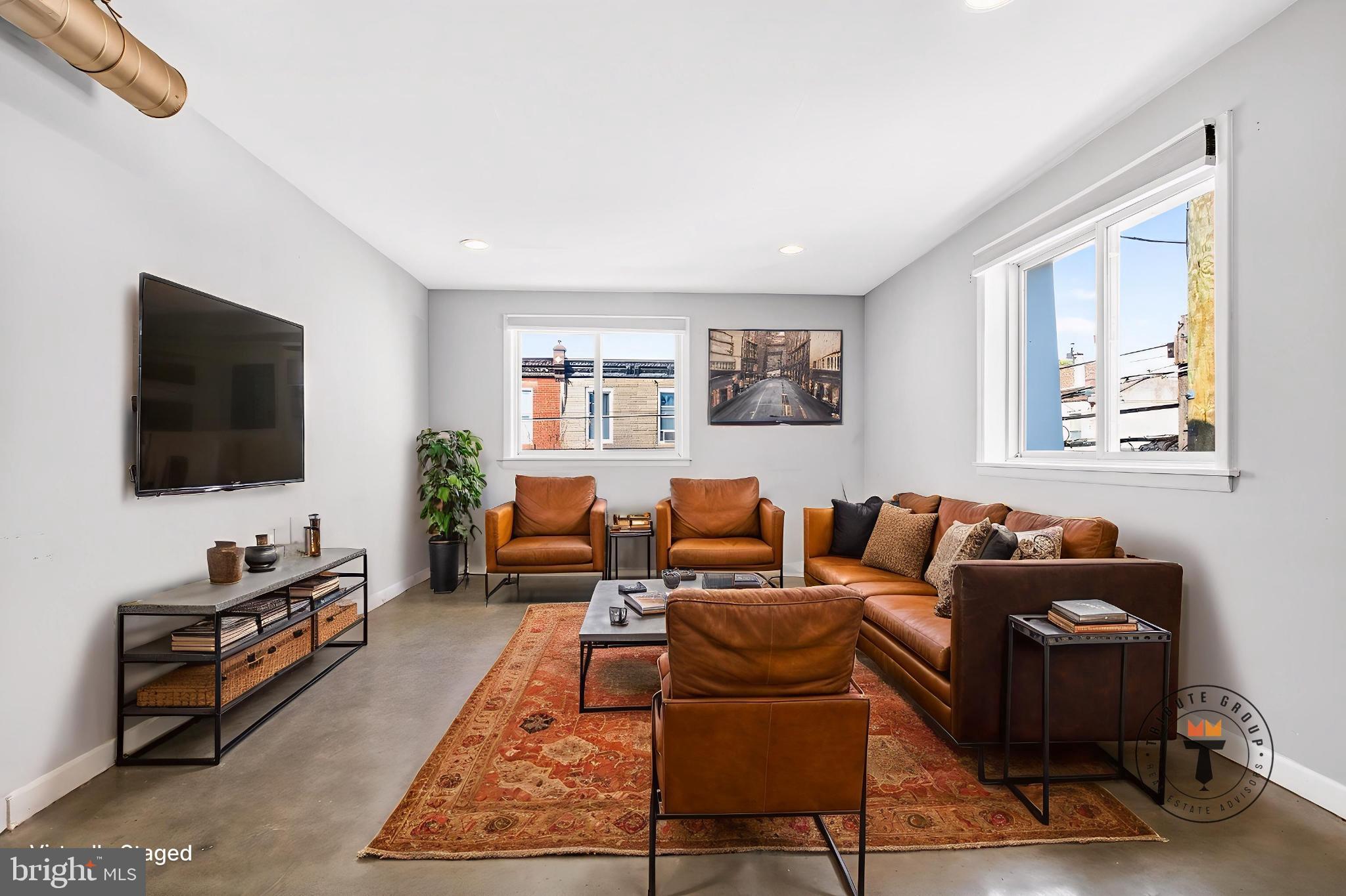 2579 Memphis Street, Unit 2 Philadelphia, PA 19125 - Photo 6 of 19 a living room with furniture and a flat screen tv