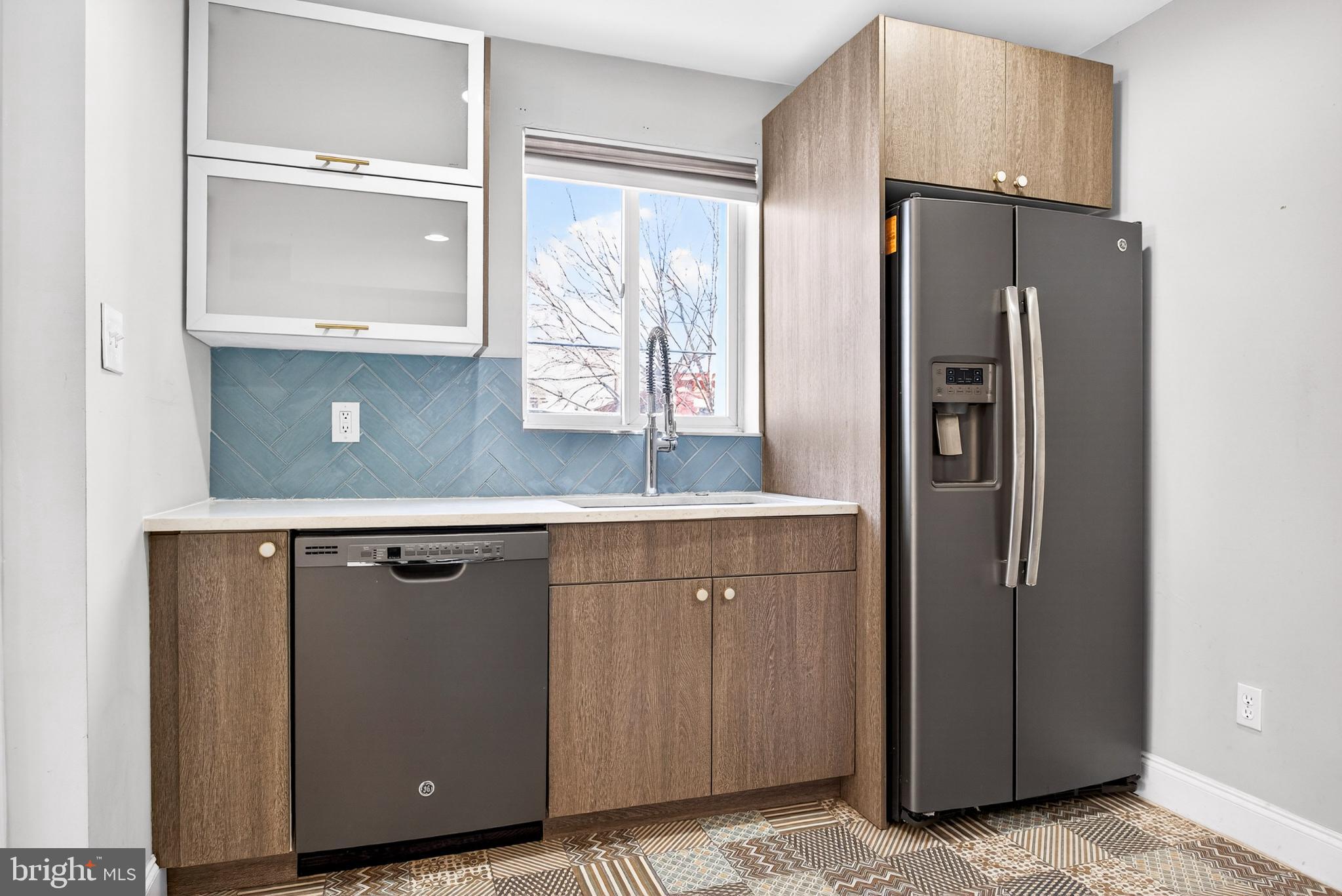 2579 Memphis Street, Unit 2 Philadelphia, PA 19125 - Photo 9 of 19 a kitchen with stainless steel appliances granite countertop a refrigerator and a sink