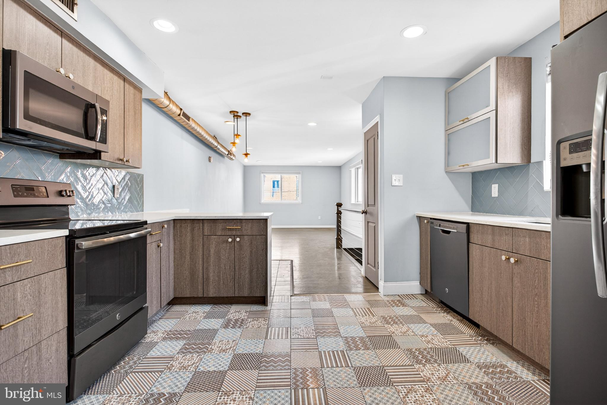 2579 Memphis Street, Unit 2 Philadelphia, PA 19125 - Photo 10 of 19 a kitchen with stainless steel appliances granite countertop a refrigerator and a stove top oven