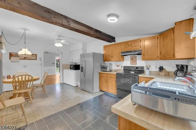 a front view of a house with outdoor seating