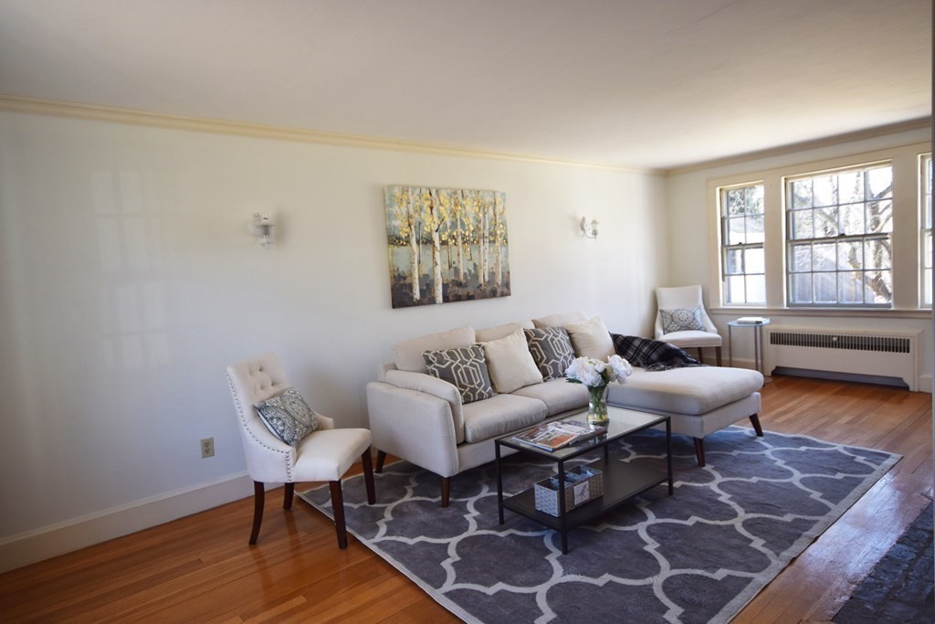 9 Wilde Road Wellesley, MA 02481 - Photo 4 of 18 a living room with furniture a rug and a wooden floor