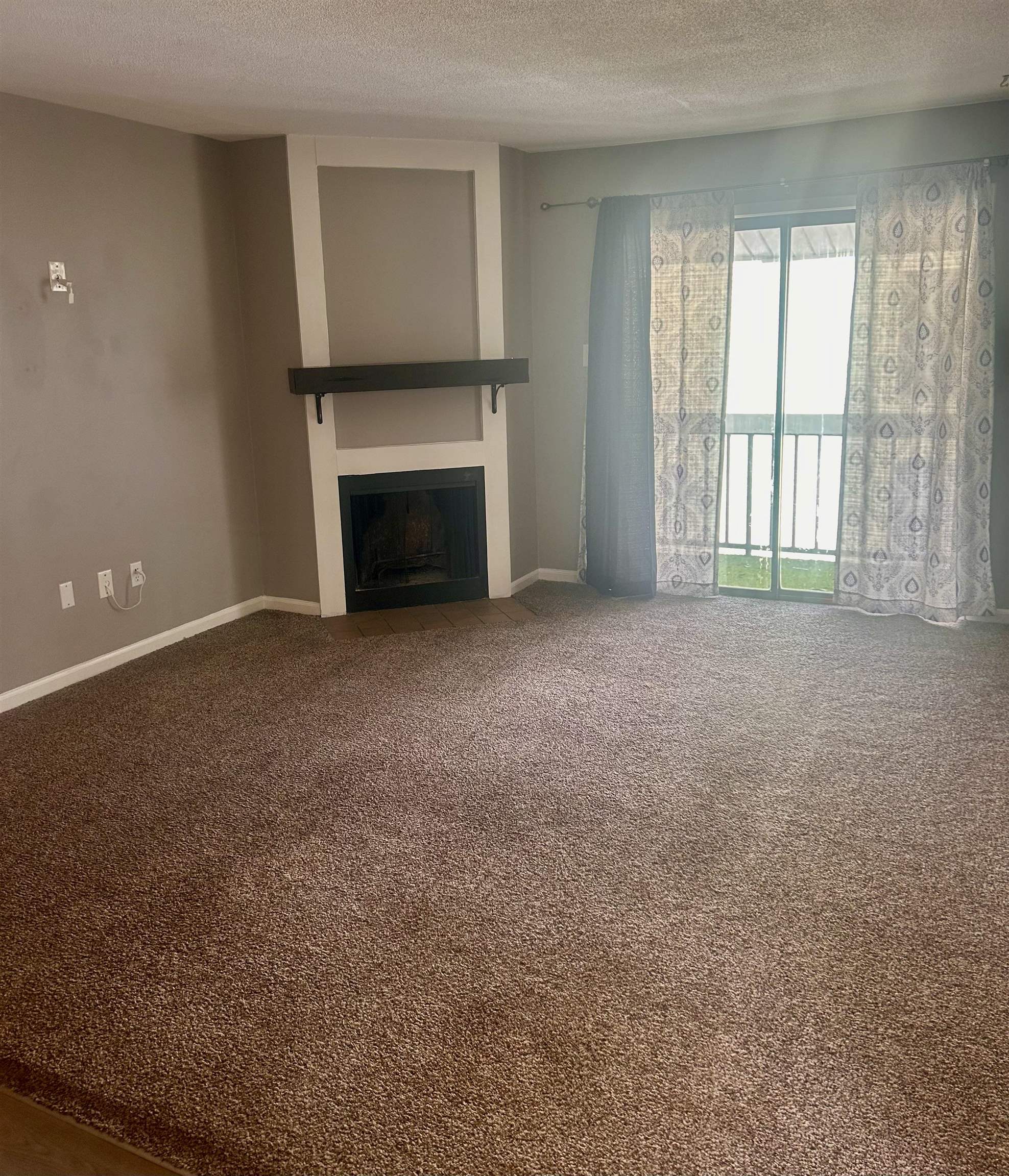 1772 6th Crompton Square, Unit B Memphis, TN 38134 - Photo 2 of 13 a view of empty room with a fireplace