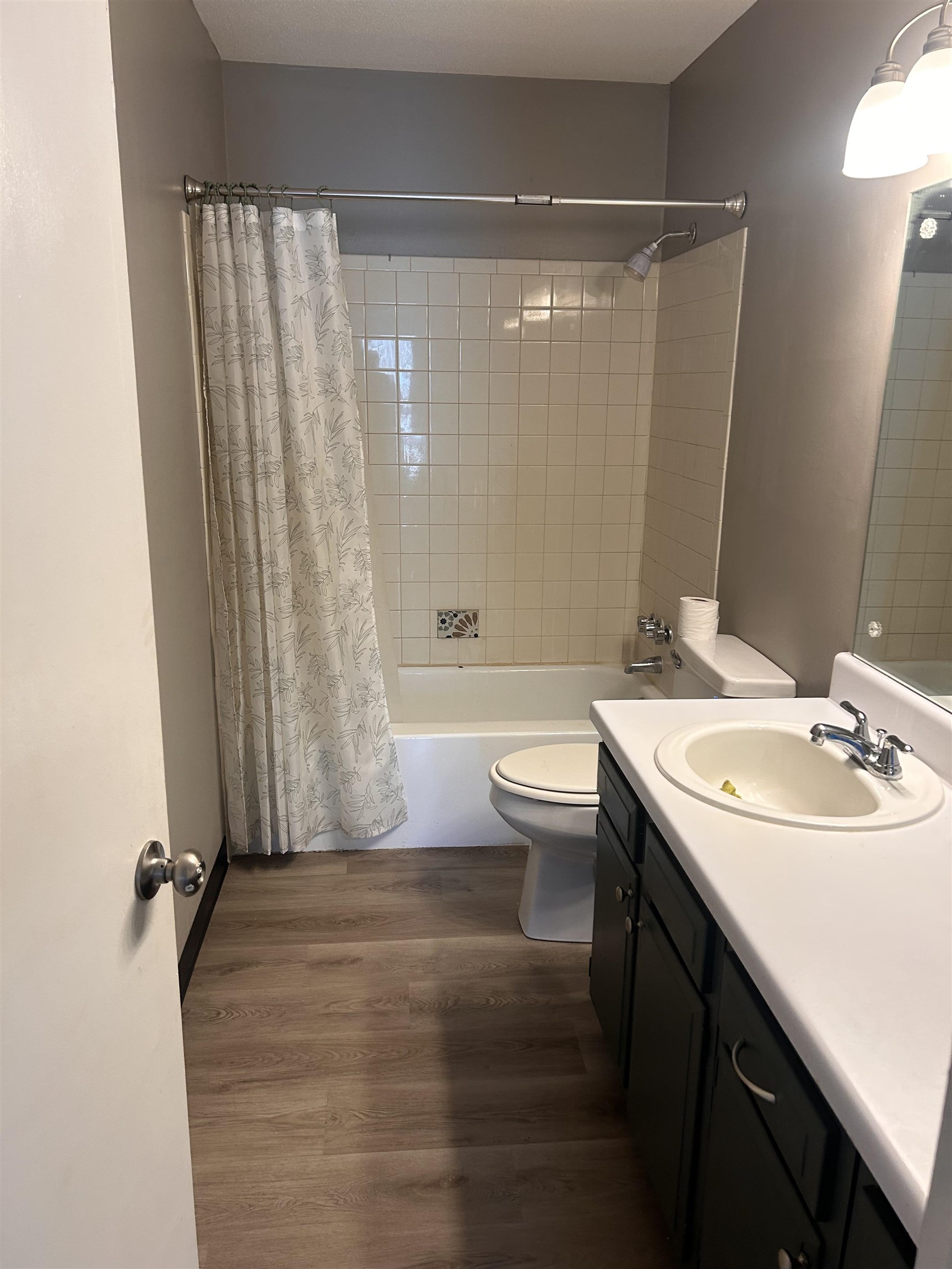 1772 6th Crompton Square, Unit B Memphis, TN 38134 - Photo 3 of 8 Full bath with vanity, shower / tub combo, and dark wood-style flooring