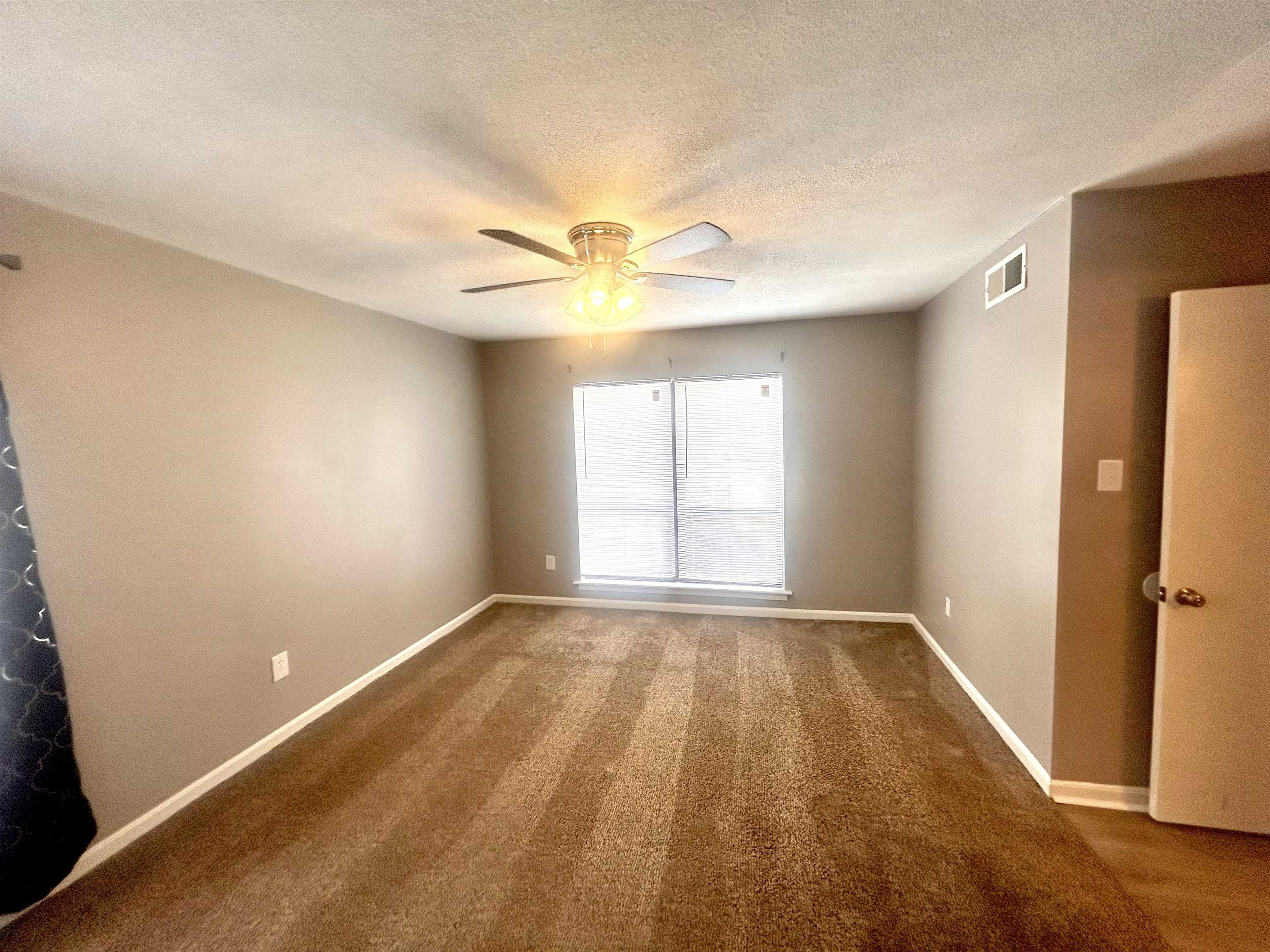 1772 6th Crompton Square, Unit B Memphis, TN 38134 - Photo 8 of 13 wooden floor in an empty room with a window