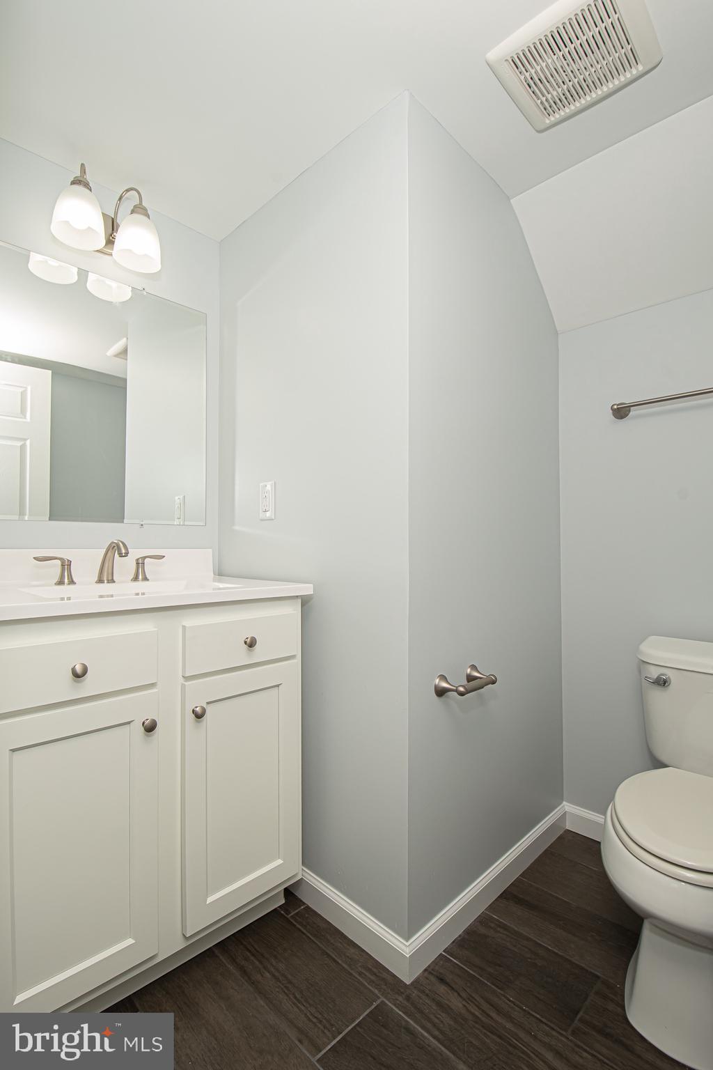 709 Ross Street Winchester, VA 22601 - Photo 32 of 40 a bathroom with a toilet sink and mirror