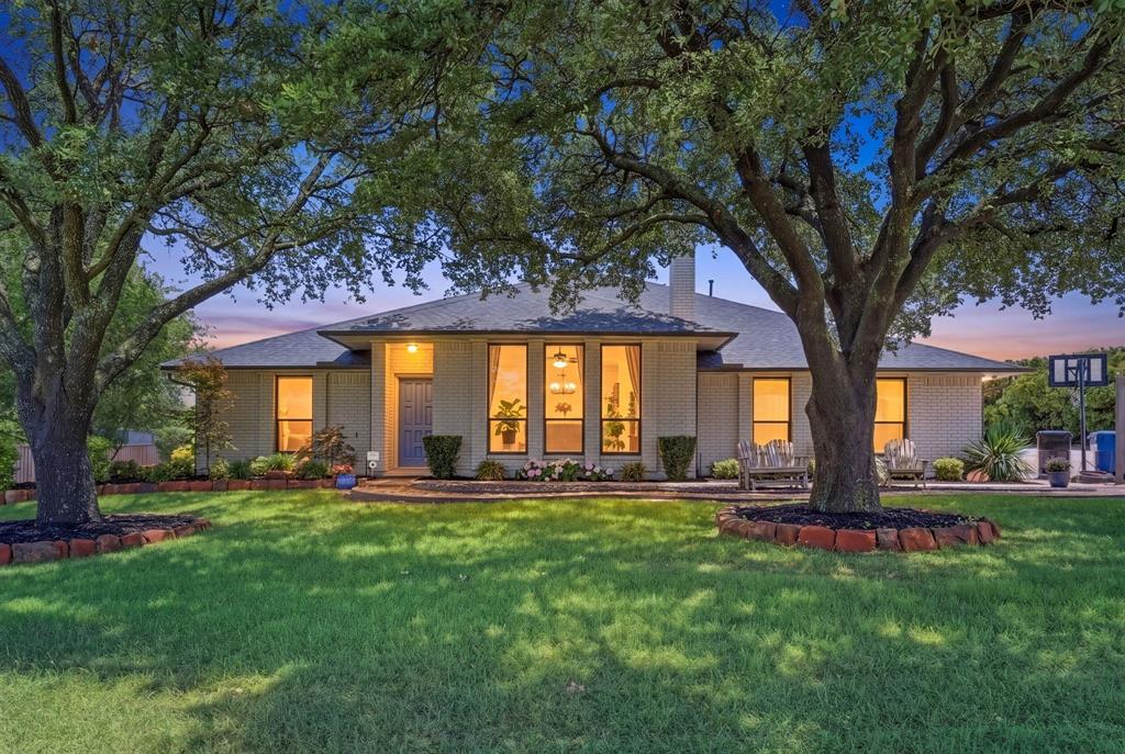 10390 Ridgecrest Street Frisco, TX 75033 - Photo 2 of 40 a large tree in front of a house with a yard