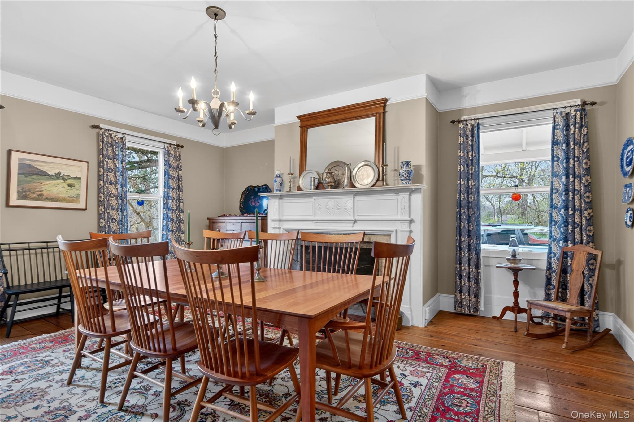90 Quaker Avenue Cornwall, NY 12518 - Photo 12 of 50 a dining room with furniture a chandelier and wooden floor