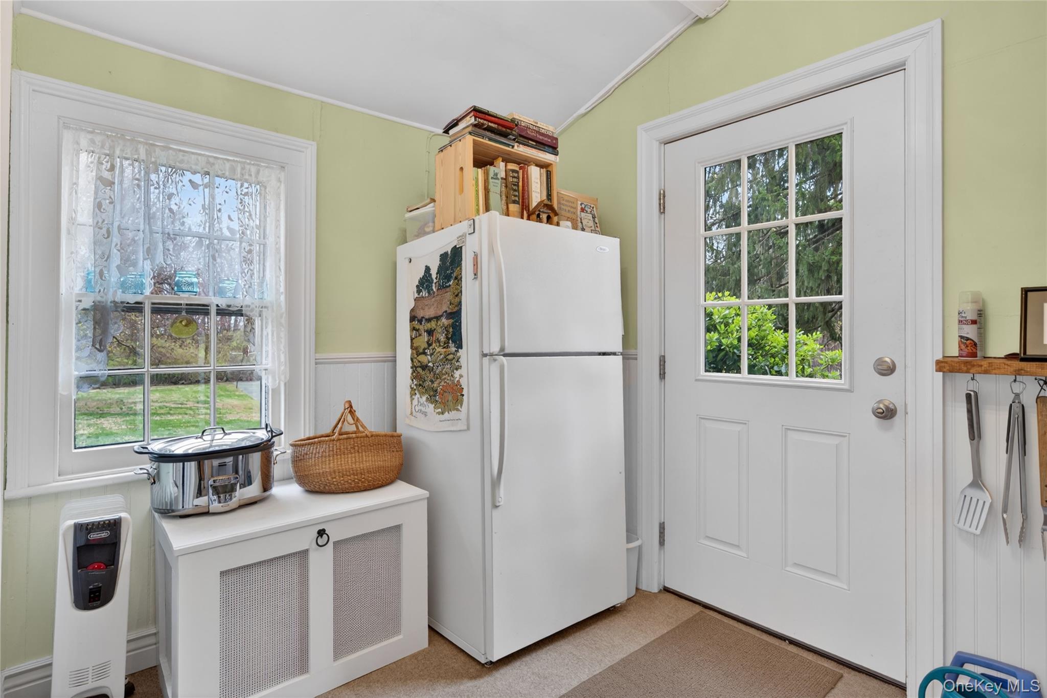 90 Quaker Avenue Cornwall, NY 12518 - Photo 19 of 50 a white refrigerator freezer and a stove sitting inside of a kitchen