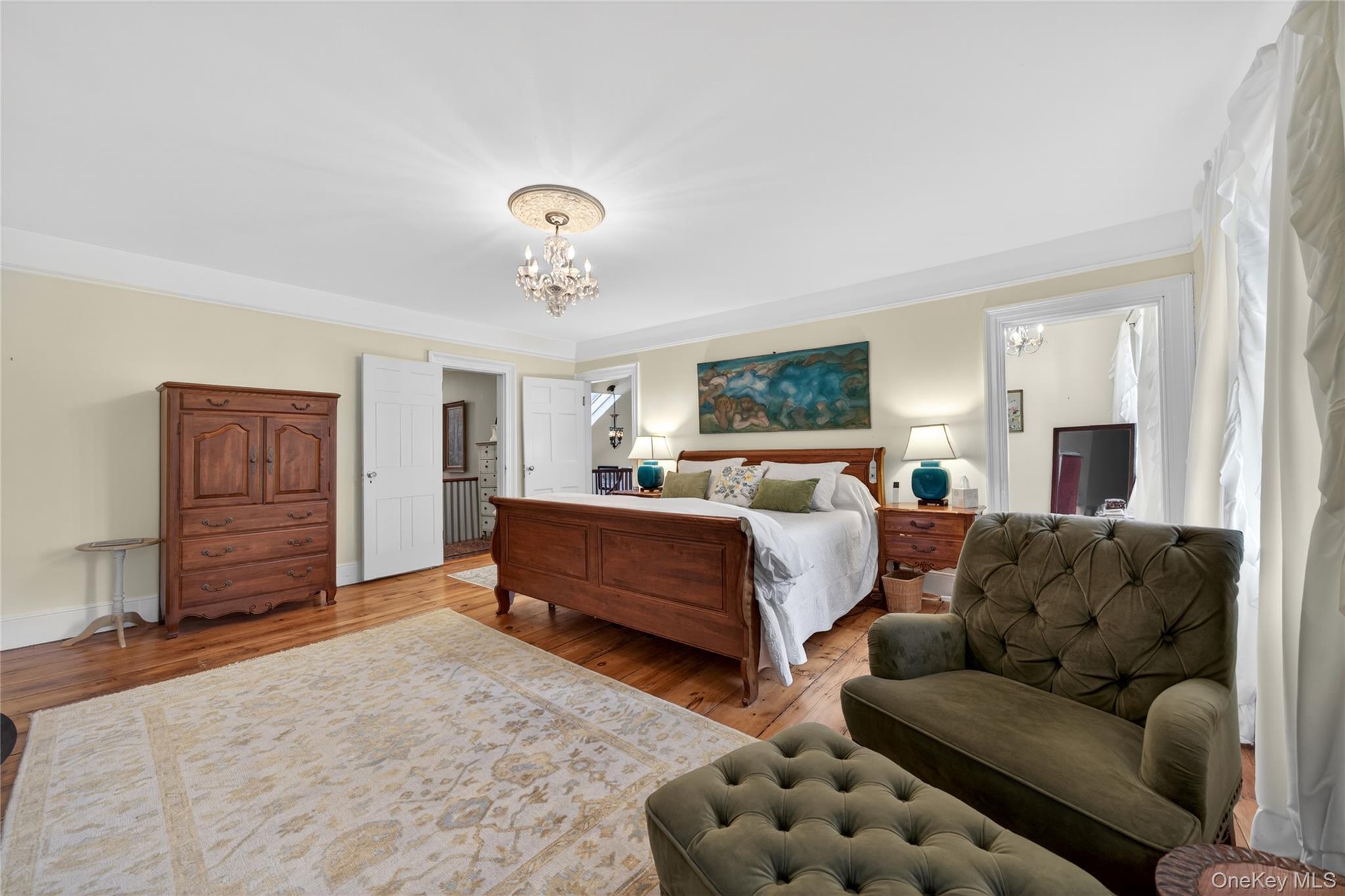 90 Quaker Avenue Cornwall, NY 12518 - Photo 28 of 50 a spacious bedroom with a bed and a couch