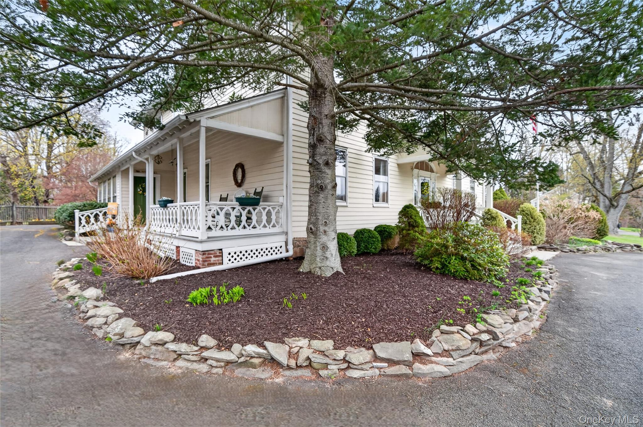 90 Quaker Avenue Cornwall, NY 12518 - Photo 37 of 50 a front view of a house with a garden and trees