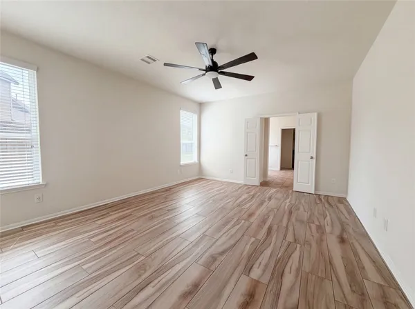 a spacious bathroom with a granite countertop sink mirror and a