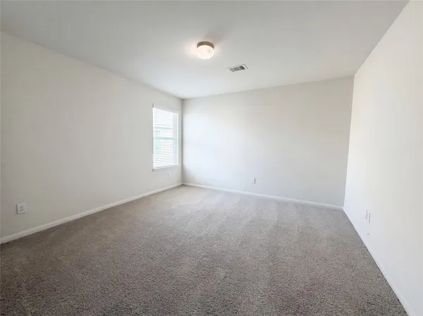 an empty room with windows mirror and windows