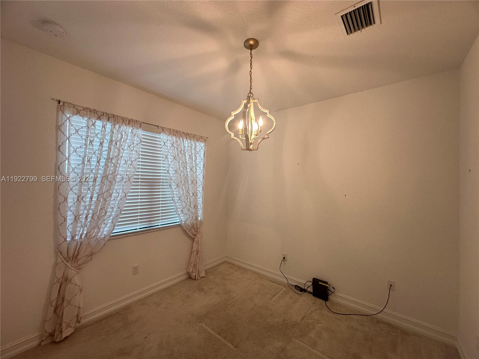 11718 Southwest 13th Ct. Pembroke Pines, FL 33025 - Photo 19 of 35 a view of empty room with windows