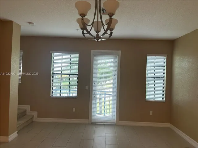 a kitchen with granite countertop stainless steel appliances and wooden cabinets