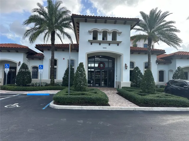 a view of a patio with table and chairs potted plants with wooden fence