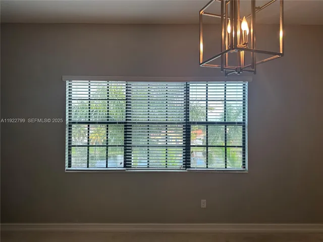 a bathroom with a shower curtain and a sink