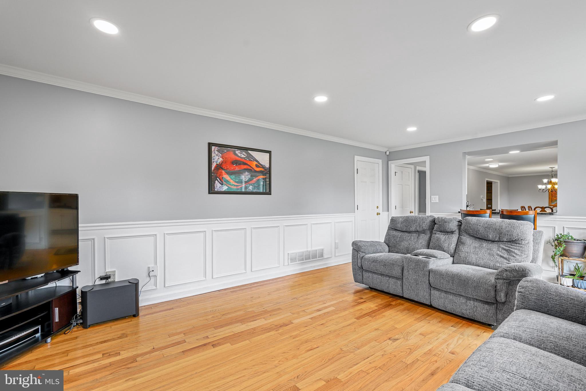 7 Congress Drive Bear, DE 19701 - Photo 12 of 37 a living room with furniture and a flat screen tv